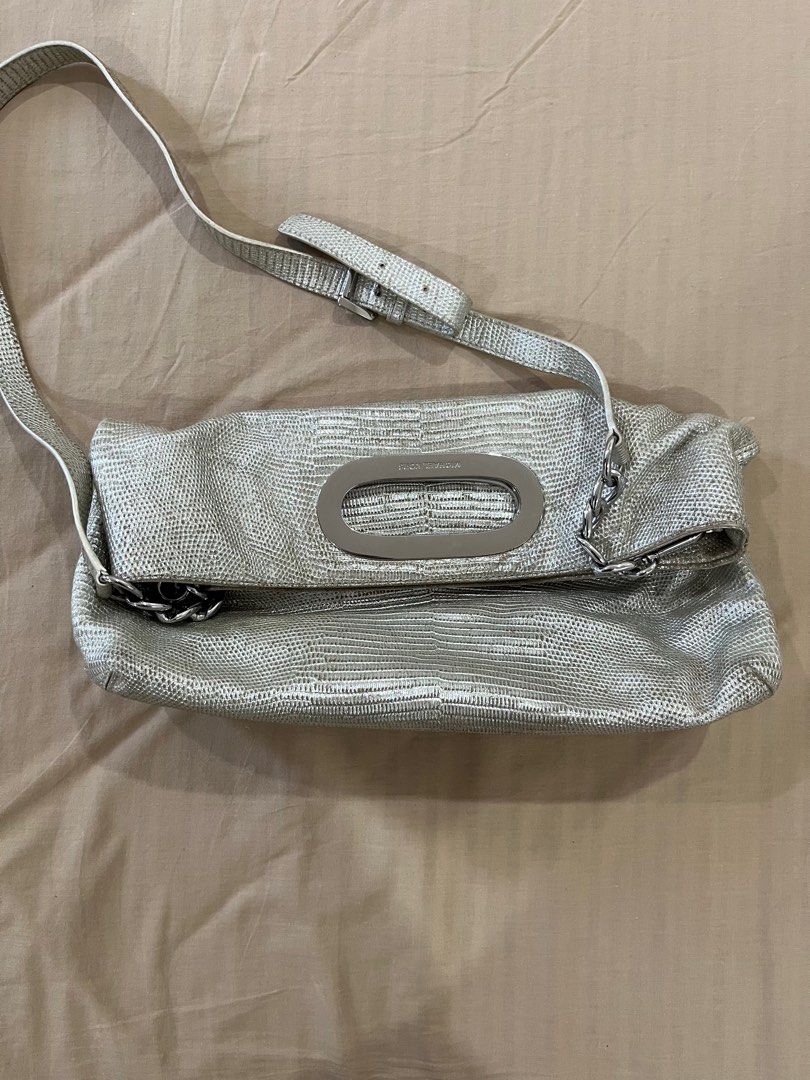 Michael Kors Metallic Berkley Clutch Bag (Category: Luxury Bags & Wallets) located in Cotabato. Submitted by nacreous (Listing ID 1416686549, Image 1). Description: Condition: 8/10 DESCRIPTION: ➤ Original pre-loved item ➤ Beautiful interior ➤ RFS: Decluttering FEATURES: Exterior ➤ Textured Leather ➤ Silver hardware ➤ Height: 11.5 in / 29.5 cm ➤ Height when folded: 7.5 in / 20 cm ➤ Width: 15.5 in / 39.5 cm ➤ Depth: 4 in / 10 cm Interior ➤ Two magn