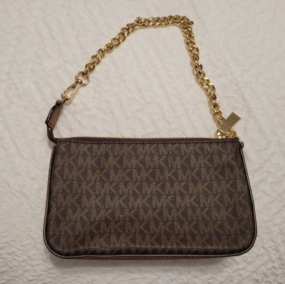 Michael Kors Pouchette Bag (Category: Luxury Bags & Wallets) located in Manila. Submitted by itemsby_jm (Listing ID 1416819811, Image 2). Description: Selling my authentic MK Pouchette sling/shoulder bag • Condition: Like new • Color: Brown with gold • Hardware: Gold-tone • Straps: Chain strap + adjustable leather strap (removable) • Style: Kili-kili bag / Sling / Crossbody 📦 Selling because not in use 💗 DM for any inquiries ☺️ 💰Mode of paymen