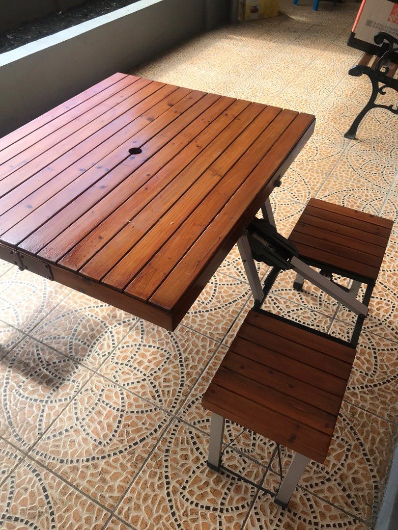 Portable (PICNIC) Wooden Folding Table with Benches (Category: Tables & Sets) located in Caloocan City. Submitted by etnomlebci21334 (Listing ID 1415379222, Image 2). Description: - Portable folding table set - Wooden tabletop and benches - Sturdy metal frame - Folds into a compact suitcase - Easy storage and transport - Ideal for picnics, camping, or extra seating - Table has a hole in the center.