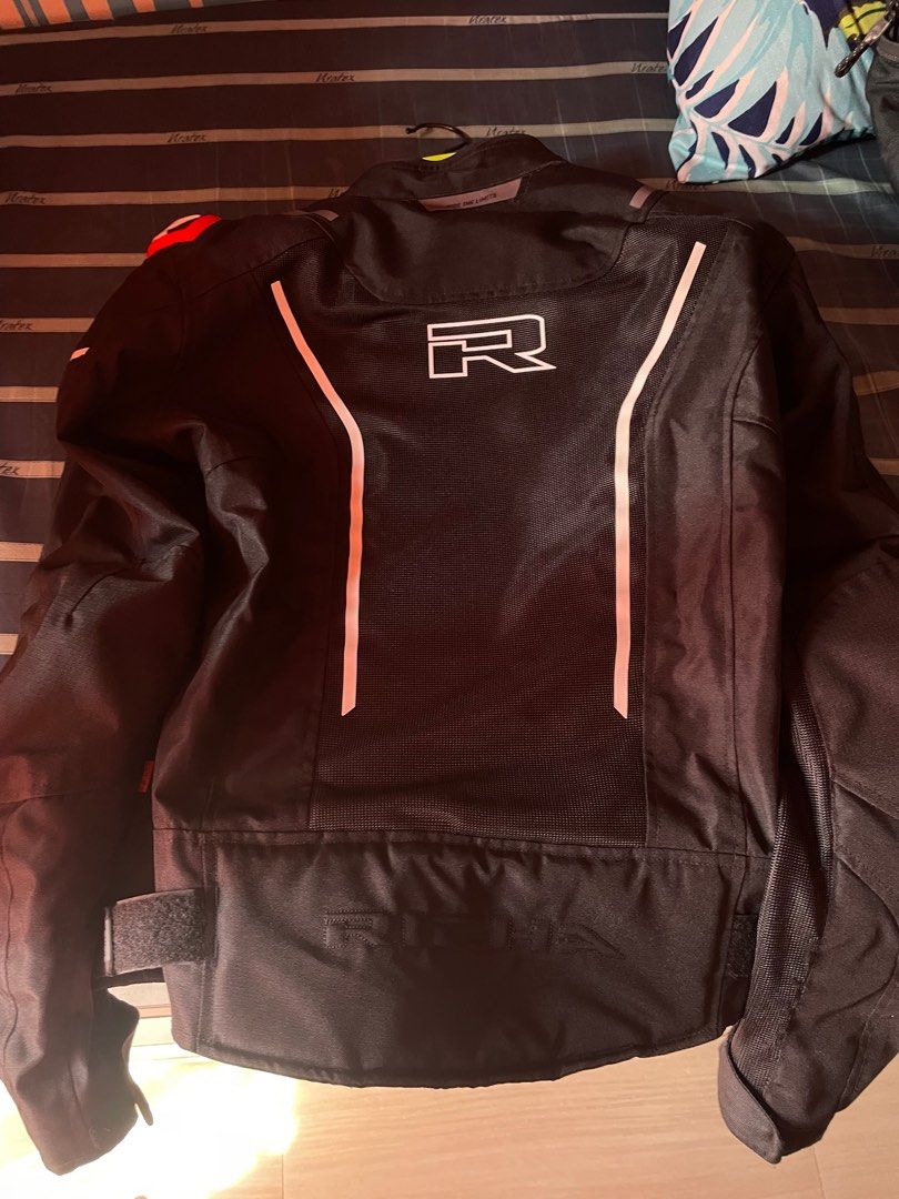 Richa Motorcycle Jacket (Category: Coats, Jackets and Outerwear) located in Quezon City. Submitted by es0nn (Listing ID 1416725032, Image 2). Description: RUSH - Black Richa motorcycle jacket - Mesh lining - Multiple pockets - Reflective accents - Richa logo (front and back) - Zipper closure - Adjustable cuffs - Minor wear on mesh material.