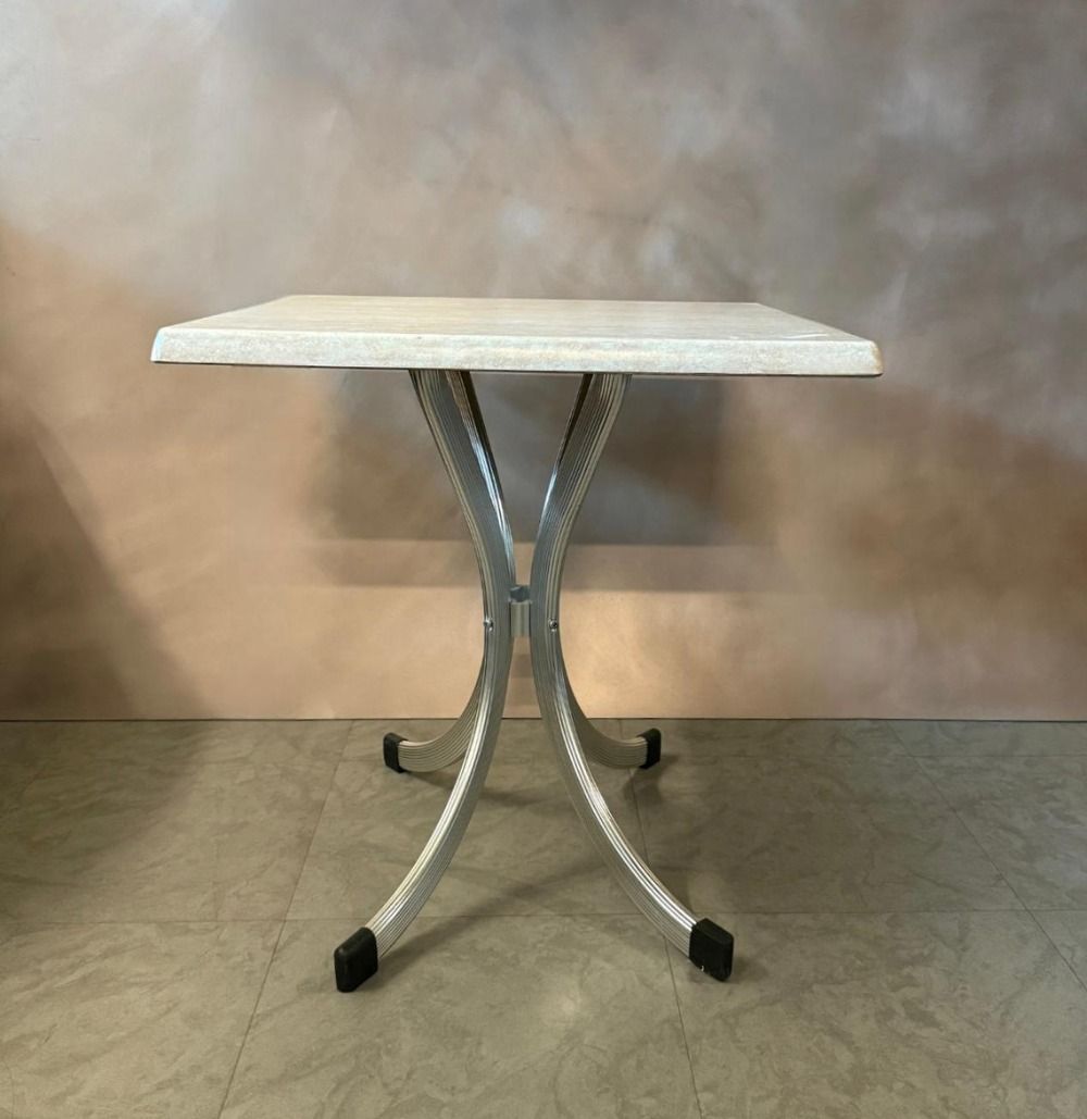 Solid PVC Beige Top Table (Category: Tables & Sets) located in Singapore. Submitted by decoexpressionsg (Listing ID 1416689136, Image 1). Description: Square table with a light beige stone-like top and elegant silver aluminium curved legs. The design is simple yet stylish, making it suitable for cafes, dining nooks, or patios. Sturdy construction with protective foot caps. Measurements (approx): Table Top length: 68.5cm Table Top width: 68.5cm Ta