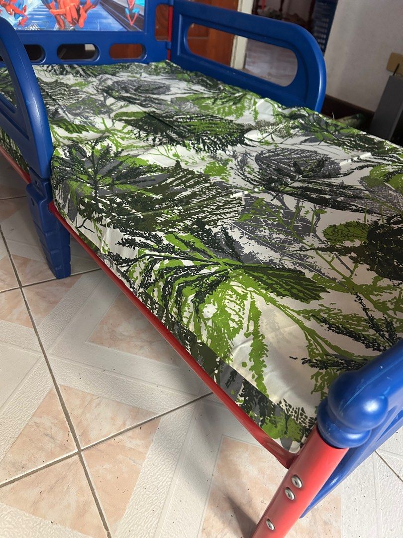 Spiderman Toddler Bed with Uratex foam (Category: Children's Beds) located in Cabanatuan. Submitted by krnlim (Listing ID 1416772278, Image 2). Description: - Spiderman-themed toddler bed - Blue frame with Spiderman graphics - Headboard and footboard feature Spiderman design - Includes 3-inches thick utarex mattress - Features side rails for safety - Ideal for toddlers transitioning from a crib RSF: decluttering .
