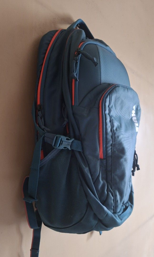 Thule Narrator Teal Backpack 31L (Category: Laptop Bags & Sleeves) located in Manila. Submitted by thrifter_lifestyle (Listing ID 1416668189, Image 2). Description: Brand: Thule Specs Style and Color: Thule Narrator Backpack 31L (Deep Teal Camo/Coral) Series : Narrator Bag volume: 31L Dimensions: 32 x 8 x 50 cm Laptop compartment: 38.5 x 26.5 x 3.1 cm Weight: 1 kg Material: Nylon (see tag) Barely used, good as new. Selling with original paperbag.