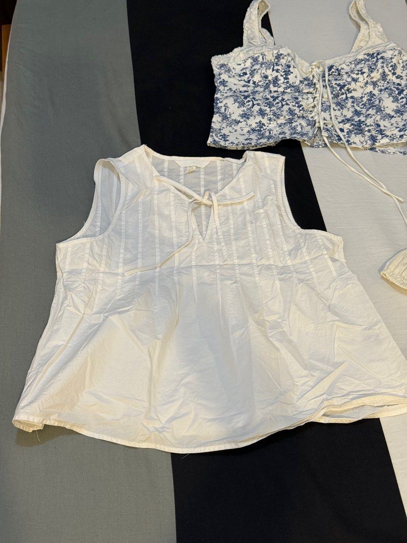 H&M WHITE PINTUCKED / PLEATED BLOUSE (Category: Sleeveless) located in Pasig City. Submitted by parisshopping (Listing ID 1416783047, Image 2). Description: H&M PINTUCKED / PLEATED BLOUSE. Php 549 ‼️‼️‼️ Sizing runs large! - White sleeveless top - Tie detail at neckline - Vertical stripe detailing - Relaxed fit - Slightly flared hem - Lightweight fabric - Versatile and easy to pair.