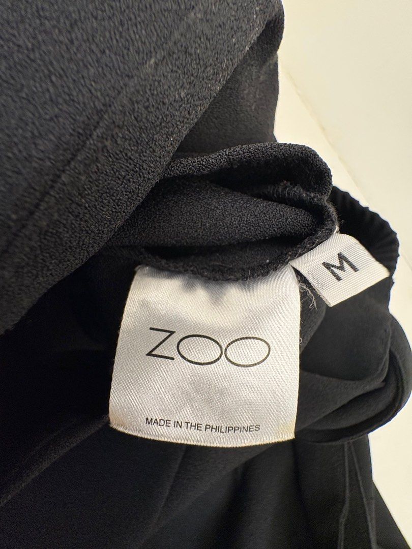Zoo Label Brianna Top (Category: Others Tops) located in Makati City. Submitted by harekrisha (Listing ID 1416794584, Image 3). Description: Black off-shoulder top with tie details on the sleeves. Size M. Purchased in 2016 and not heavily used, but there is some pilling on the crepe fabric due to age and storage. This should be manageable with a fabric shaver. Still wearable and being sold as is..