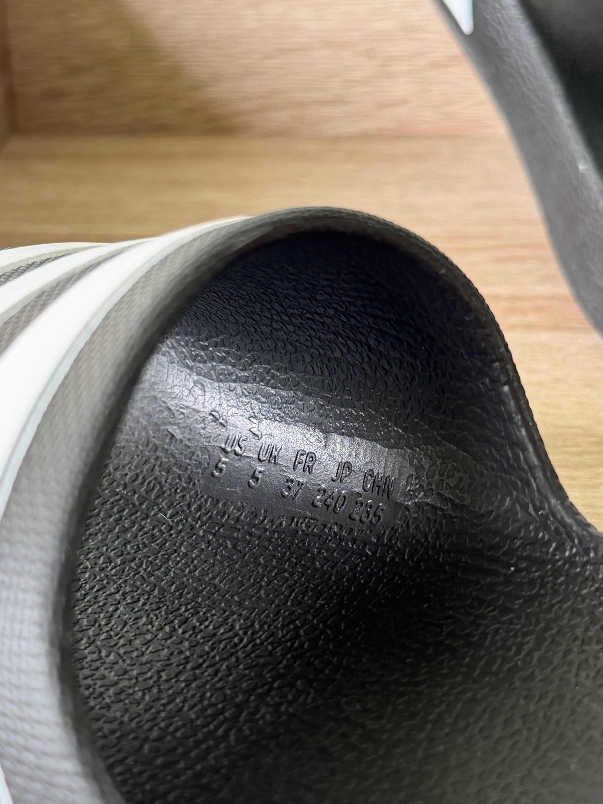 Adidas Adilette Slides - Black & White (Category: Slippers and slides) located in Lucena. Submitted by _avixx (Listing ID 1416885200, Image 2). Description: Adidas Adilette slides - Black with white stripes - Size: US 5, UK 5 - Seen in photos - Adidas logo on sole.