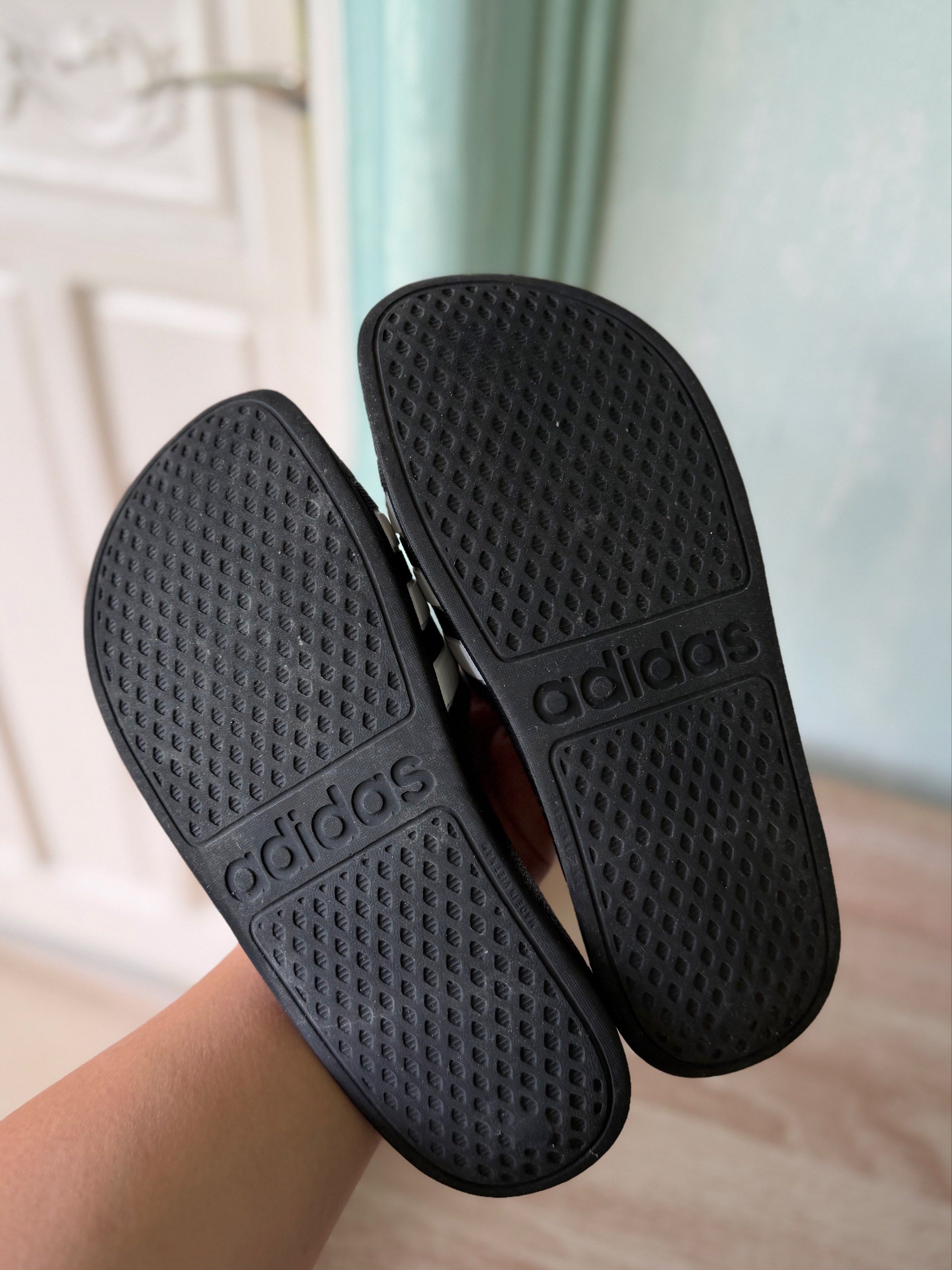 Adidas Adilette Slides - Black & White (Category: Slippers and slides) located in Lucena. Submitted by _avixx (Listing ID 1416885200, Image 3). Description: Adidas Adilette slides - Black with white stripes - Size: US 5, UK 5 - Seen in photos - Adidas logo on sole.