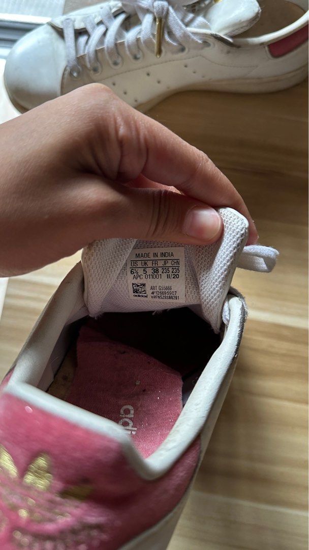 Adidas Stan Smith Sneakers (Category: Sneakers) located in Makati City. Submitted by ppsls (Listing ID 1416924660, Image 2). Description: - Adidas Stan Smith sneakers - Size: 6.5 US - Color: White with red and gold accents - Made in India - Soles: Intact - Laces: Present - Suitable for casual wear.
