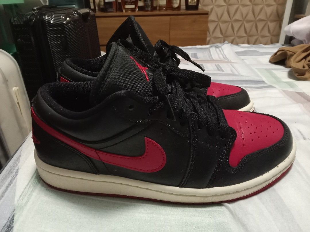 Air Jordan 1 Low Black Red (Category: Sneakers) located in Marikina City. Submitted by jaebe (Listing ID 1416985006, Image 2). Description: - Air Jordan 1 Low sneakers - Black upper with red accents - Iconic Nike swoosh and Air Jordan logo - White sole with red outsole - Size: US 7, EUR 38, CM 24 - Made in Vietnam.