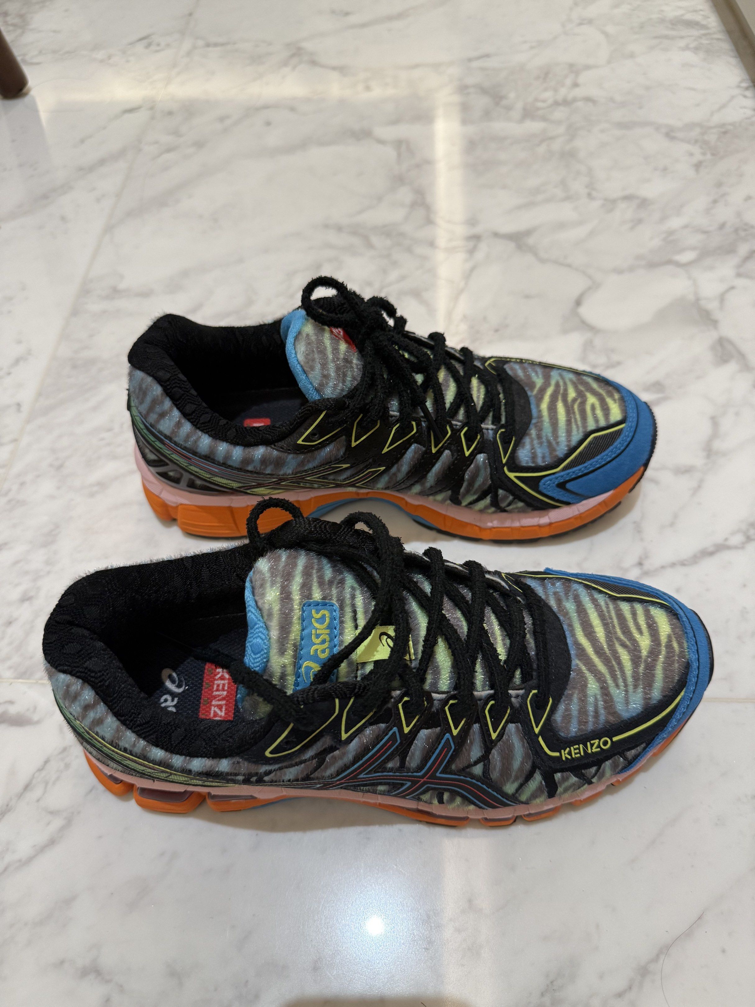Asics x Kenzo Gel-Kayano Trainer (Category: Sneakers) located in Singapore. Submitted by kkk.ling (Listing ID 1416959655, Image 1). Description: - Asics x Kenzo Gel-Kayano Trainer sneakers - Unique zebra print design - Features blue and orange accents - Size: US 8, UK 7 - Condition: Good (wore one only ) - Adds a pop of color to your outfit.