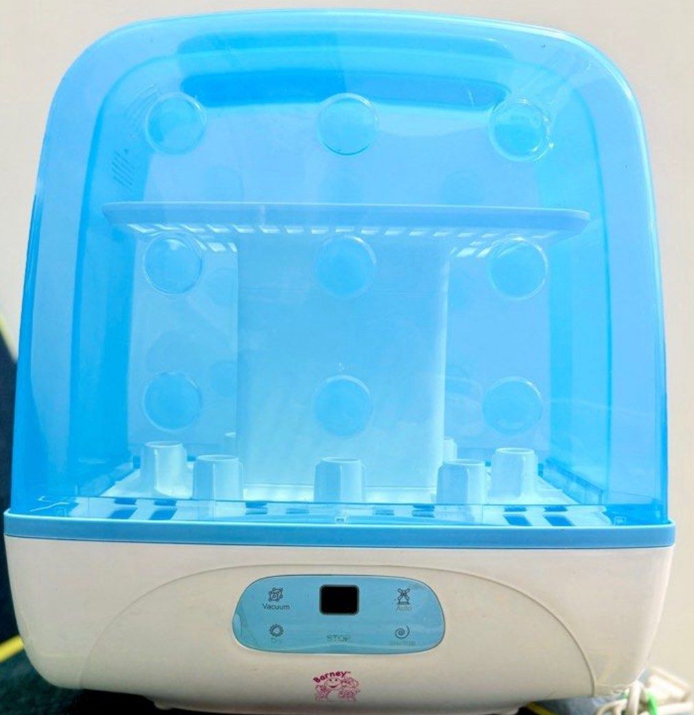 Barney Bottle Sterilizer (Category: Breastfeeding & Bottle Feeding) located in Manila. Submitted by declutterb (Listing ID 1416897008, Image 2). Description: - Sterilizes up to 8 bottles - Digital display - Blue and white color scheme - BPA-free.