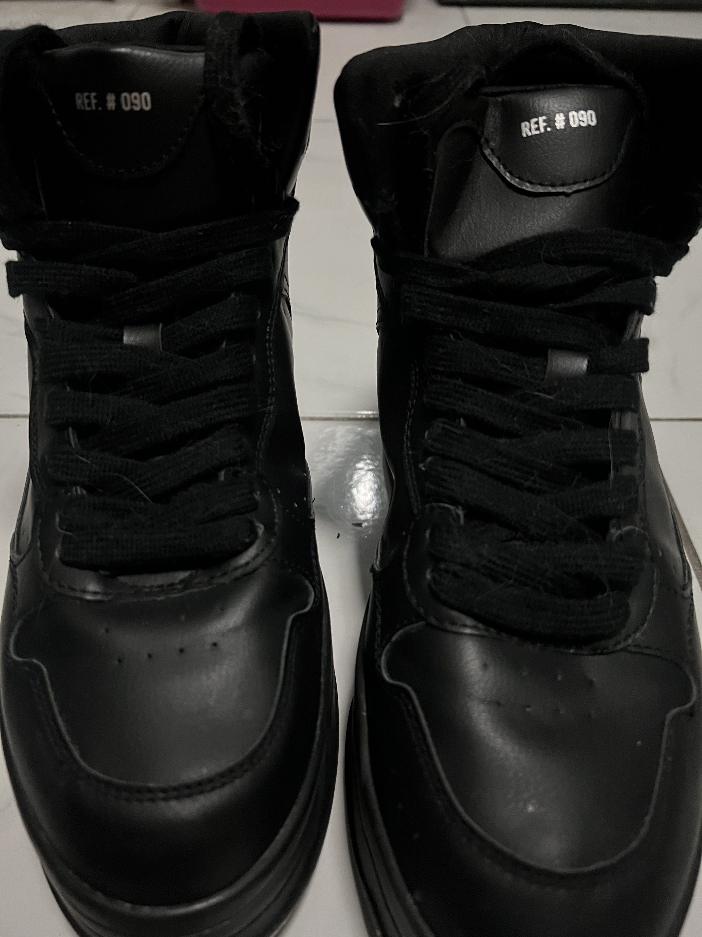 Bershka High-Top Sneakers (Category: Sneakers) located in Manila. Submitted by lanzyhowell (Listing ID 1417008473, Image 2). Description: (Negotiable if buying multiples) - Bershka high-top sneakers - Size 40 - All-black design - Thick sole - Lace-up closure - Leather-like material - Ref. #090.