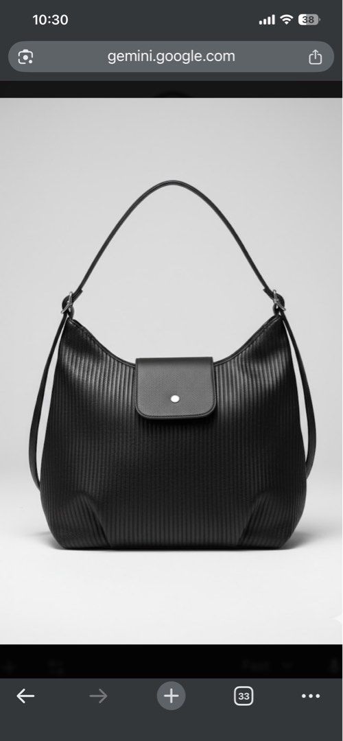 Black Hobo Bag with Shoulder Strap (Category: Shoulder Bags) located in Quezon City. Submitted by kmalaza (Listing ID 1416986004, Image 1). Description: - Stylish black hobo bag - Unique textured design - Flap closure with single button - Includes shoulder strap - Spacious interior - Suitable for everyday use - Sleek, modern design.