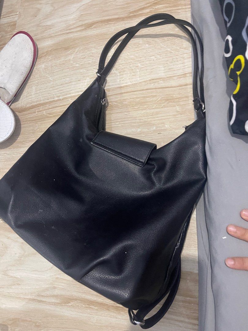 Black Hobo Bag with Shoulder Strap (Category: Shoulder Bags) located in Quezon City. Submitted by kmalaza (Listing ID 1416986004, Image 3). Description: - Stylish black hobo bag - Unique textured design - Flap closure with single button - Includes shoulder strap - Spacious interior - Suitable for everyday use - Sleek, modern design.