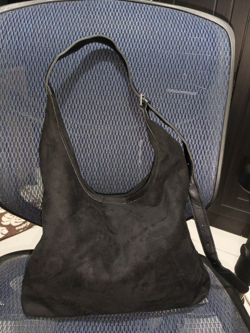 Black Suede Shoulder Bag/ Sling Bag (Category: Shoulder Bags) located in Davao. Submitted by zoiesells_63 (Listing ID 1416869648, Image 1). Description: - Black suede shoulder bag - Single strap design - Elegant curved shape - Secure snap closure - Lined interior - Ideal for daily wear.