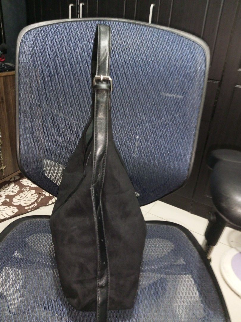 Black Suede Shoulder Bag/ Sling Bag (Category: Shoulder Bags) located in Davao. Submitted by zoiesells_63 (Listing ID 1416869648, Image 2). Description: - Black suede shoulder bag - Single strap design - Elegant curved shape - Secure snap closure - Lined interior - Ideal for daily wear.