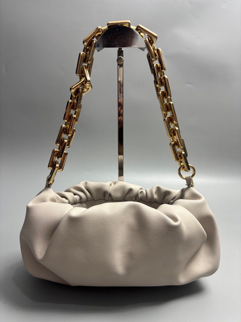 Bottega Veneta The Chain Pouch (Category: Luxury Bags & Wallets) located in Quezon City. Submitted by lucky.purelux.ph (Listing ID 1416932371, Image 1). Description: Bottega Veneta The Chain Pouch in plaster or ecru calfskin leather with gold-tone hardware. Free shipping within Metro Manila Additional shipping charges for provincial deliveries Please read the description before buying MOP: gcash, bank transfer (bpi) Courier: J&T, lalamove Please 