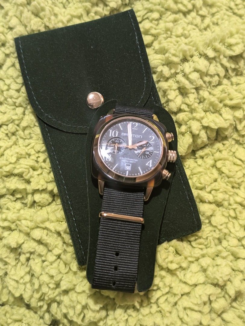 Briston Clubmaster Chronograph Watch (Category: Men's Watches) located in Muntinlupa City. Submitted by luckyfrogzone (Listing ID 1416892029, Image 1). Description: Briston Clubmaster chronograph watch with a black strap and a rose gold case. The watch features a date display and multiple sub-dials. The watch is accompanied by a green pouch. The strap has a rose gold buckle with the Briston logo..