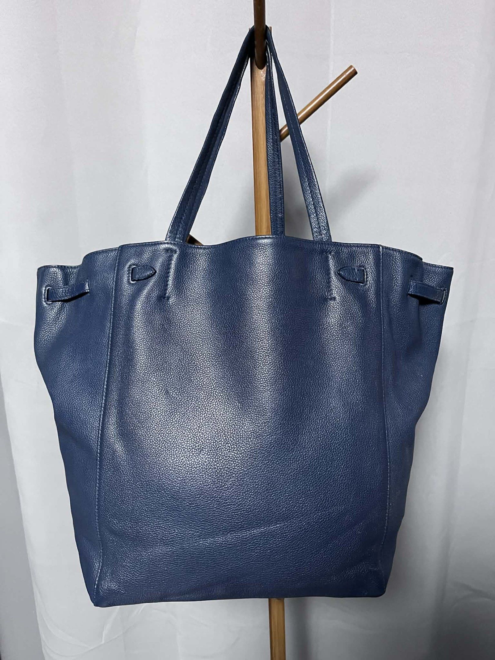 Celine Cabas Phantom Tote Bag (Category: Luxury Bags & Wallets) located in Quezon City. Submitted by carmeladelacruz82 (Listing ID 1416960782, Image 2). Description: - AUTHENTIC Celine Cabas Phantom Tote Bag - Color: Blue - Material: Leather - Condition: No major flaws; the bag is super clean, inside and out. - Issue: There is a small scuff sa taas nung bag but barely noticeable (see last picture) .