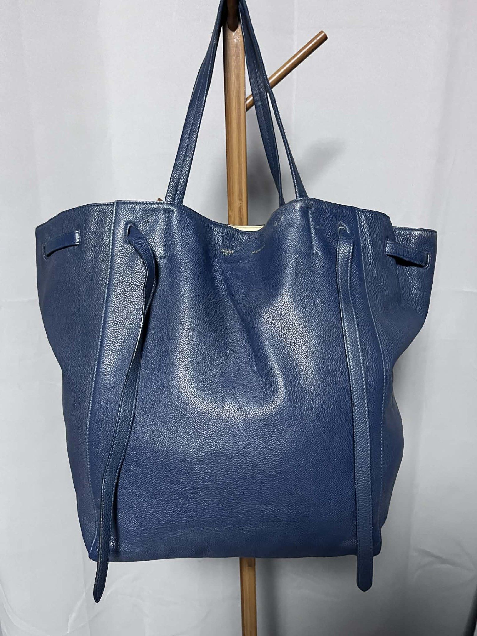 Celine Cabas Phantom Tote Bag (Category: Luxury Bags & Wallets) located in Quezon City. Submitted by carmeladelacruz82 (Listing ID 1416960782, Image 1). Description: - AUTHENTIC Celine Cabas Phantom Tote Bag - Color: Blue - Material: Leather - Condition: No major flaws; the bag is super clean, inside and out. - Issue: There is a small scuff sa taas nung bag but barely noticeable (see last picture) .