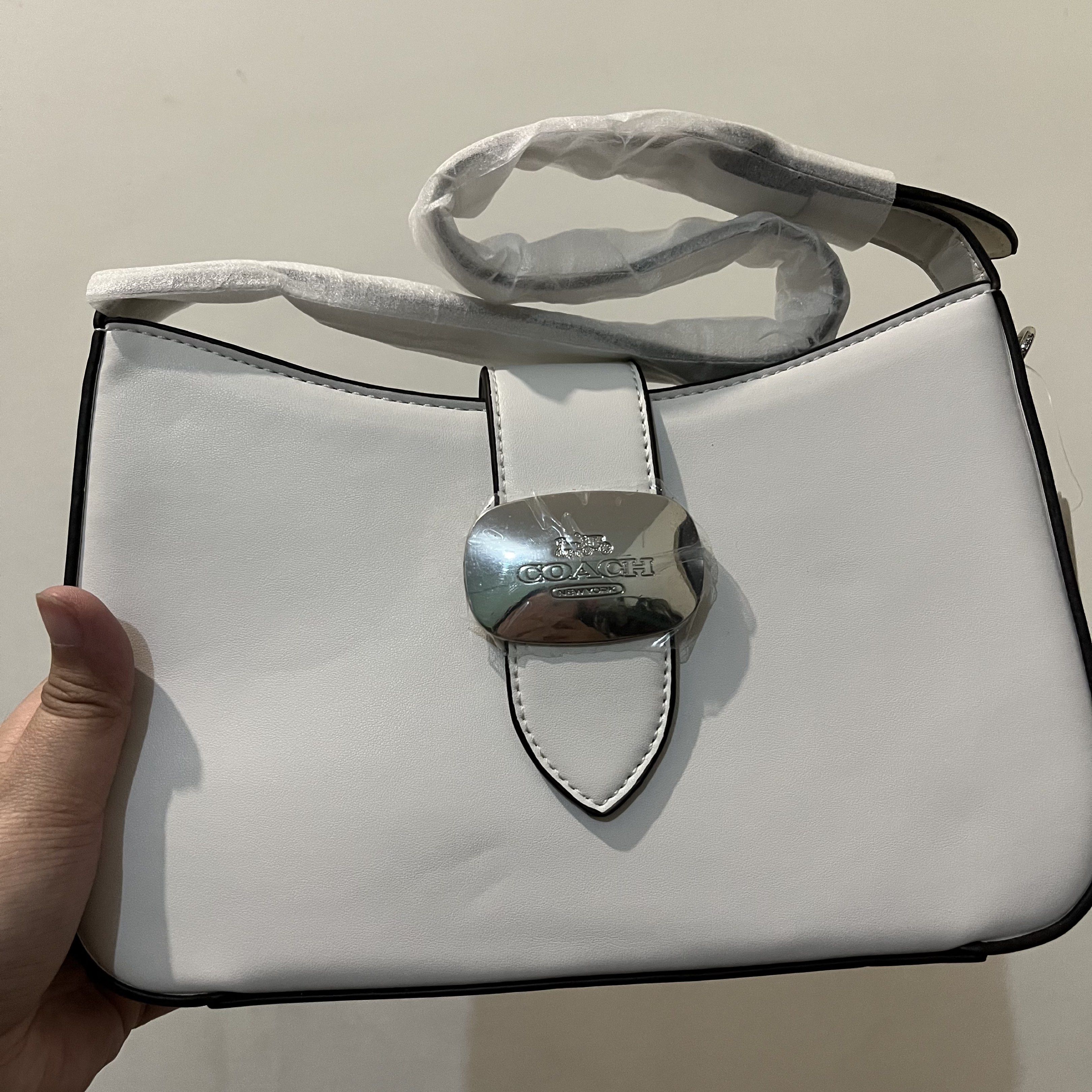 Coach White Shoulder Bag with Silver Buckle (Category: Luxury Bags & Wallets) located in San Pedro. Submitted by rainyydayy (Listing ID 1416975731, Image 3). Description: Pm me.