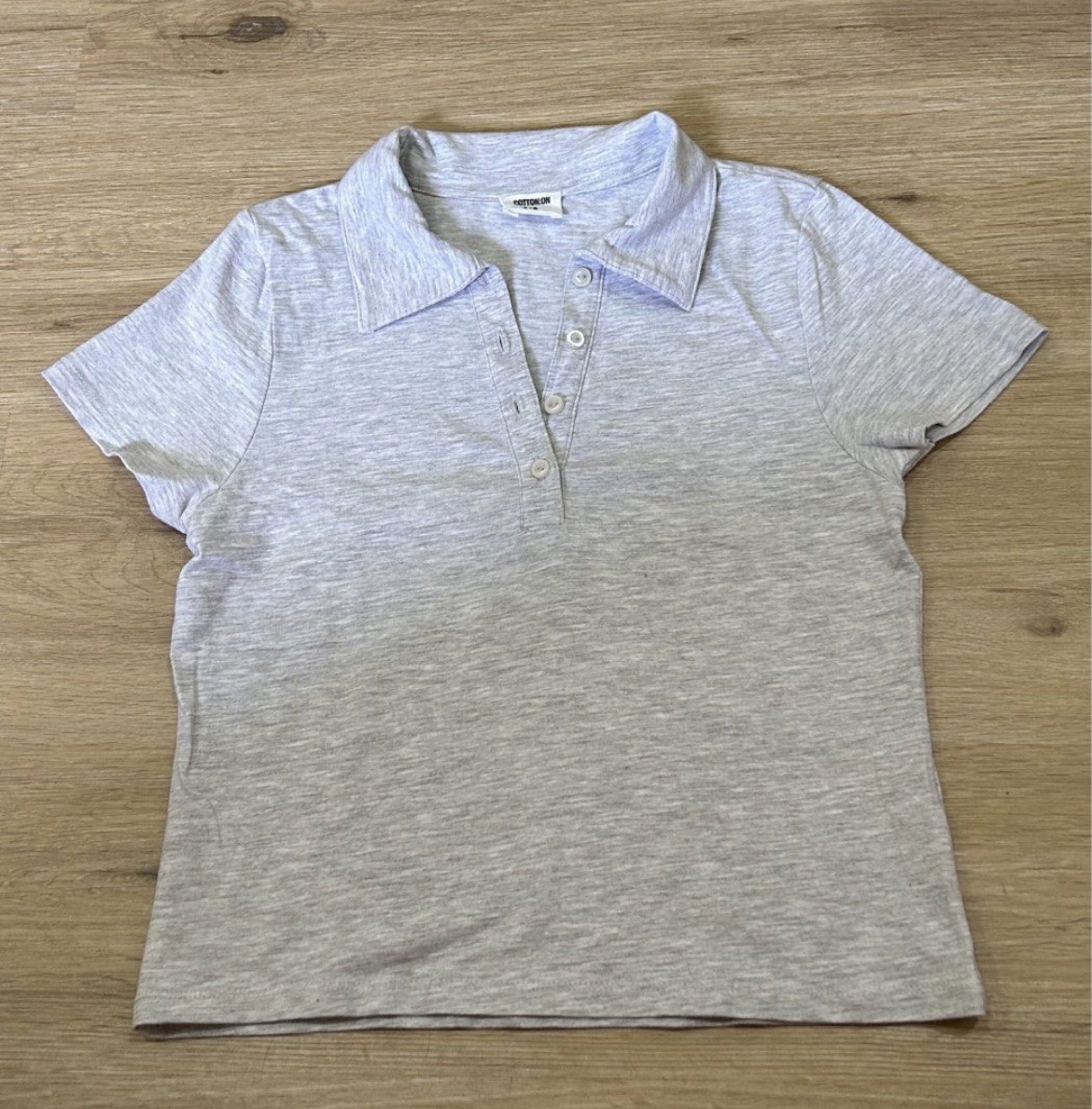 Cotton On Polo Shirt (Category: Shirts) located in Binan City. Submitted by supanovaaa (Listing ID 1416906730, Image 1). Description: - Cotton On polo shirt - Light gray color - Size: S Dimensions (in inches) L: 17.5 W: 15.
