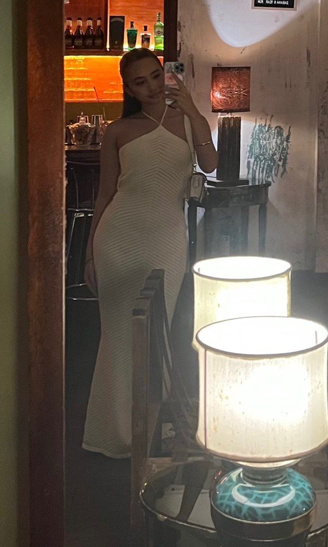 Cream Halter Neck Maxi Dress (Category: Dresses) located in Manila. Submitted by baddxss (Listing ID 1416913407, Image 1). Description: *actual when worn photos Elegant cream-colored maxi dress. Features a halter neck design and a form-fitting silhouette that flows down to the floor. The dress has a unique textured knit pattern..