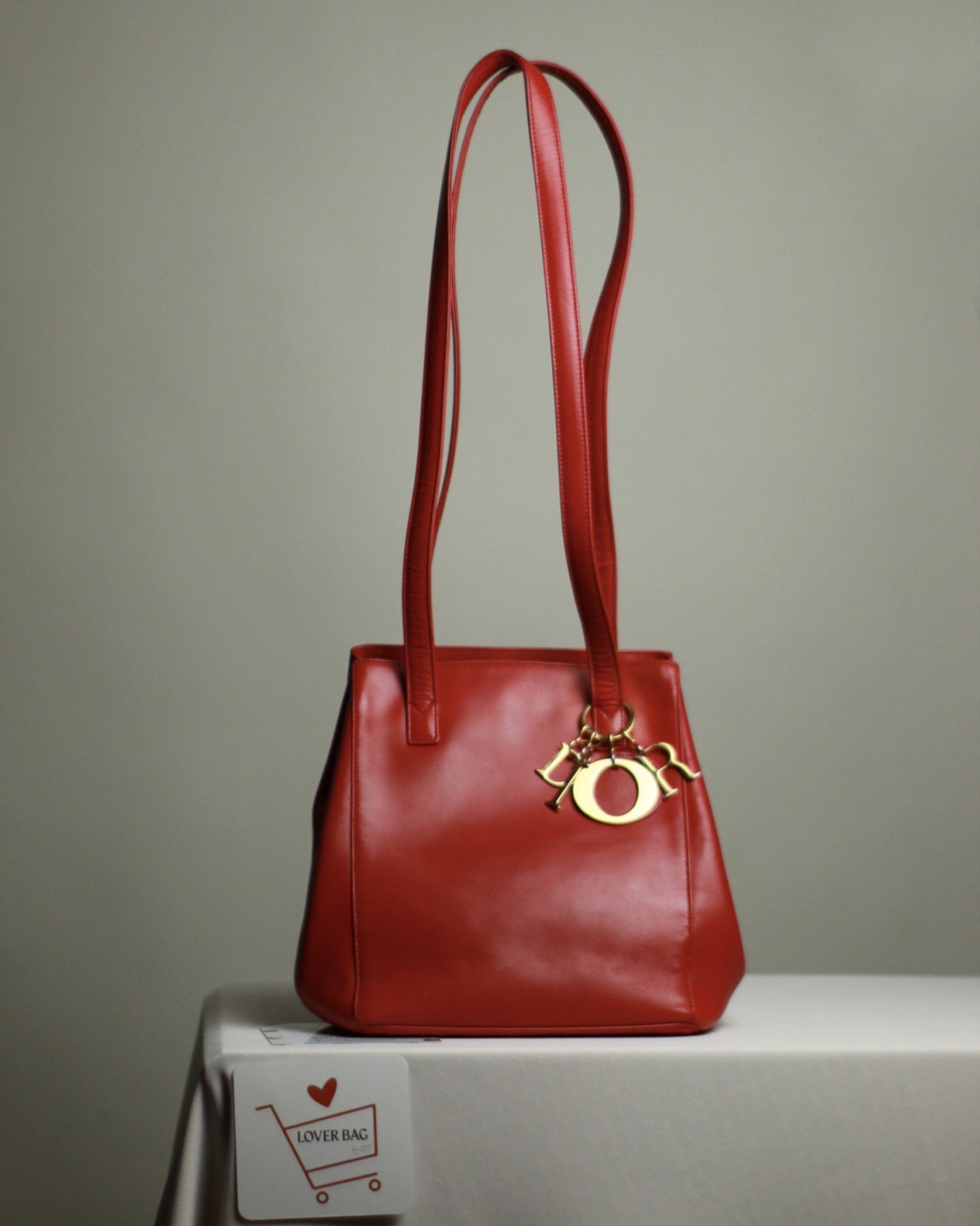 Dior RED long strap (Category: Tote Bags) located in Batangas. Submitted by bagrx (Listing ID 1417015222, Image 1). Description: Color enhanced.