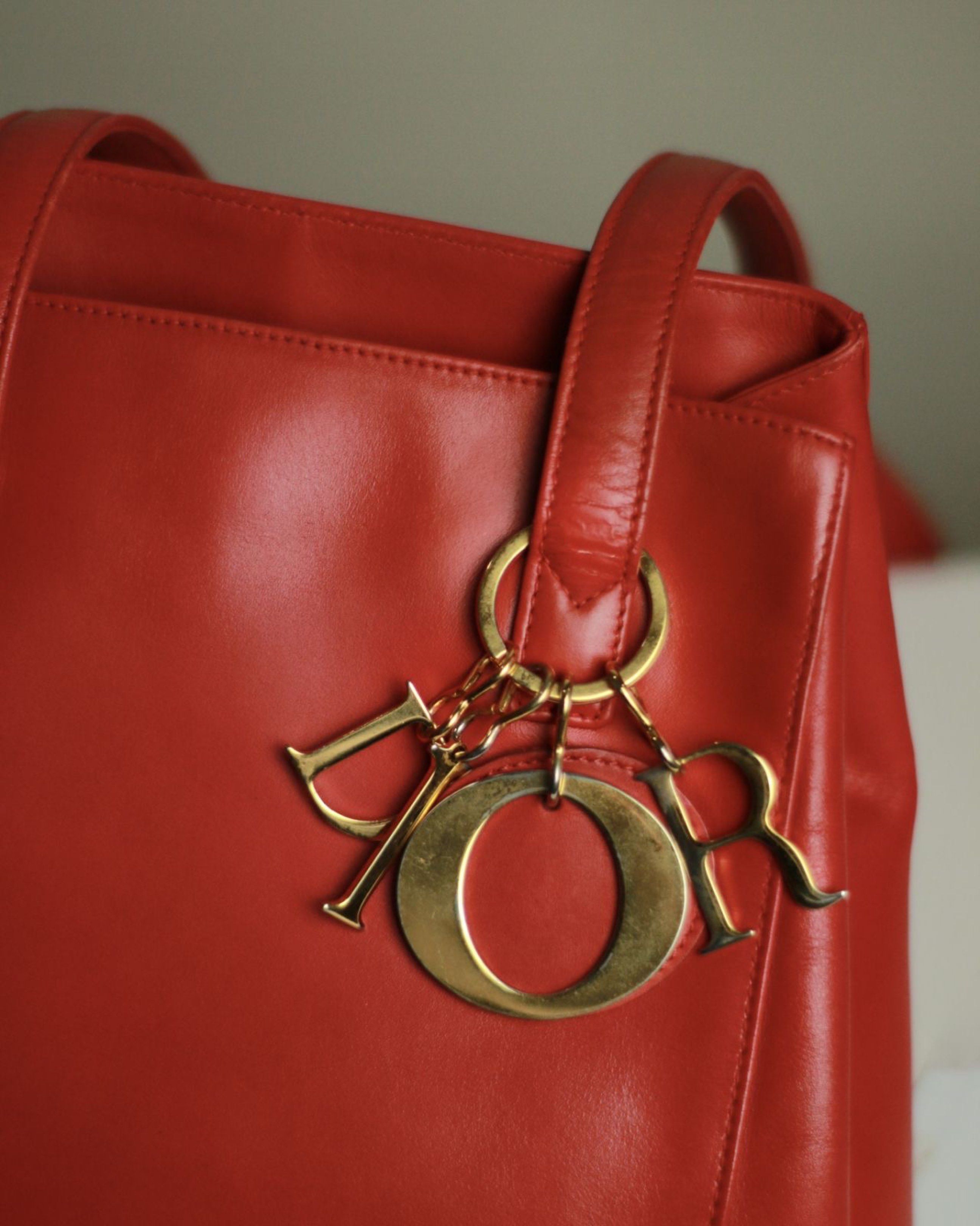 Dior RED long strap (Category: Tote Bags) located in Batangas. Submitted by bagrx (Listing ID 1417015222, Image 3). Description: Color enhanced.
