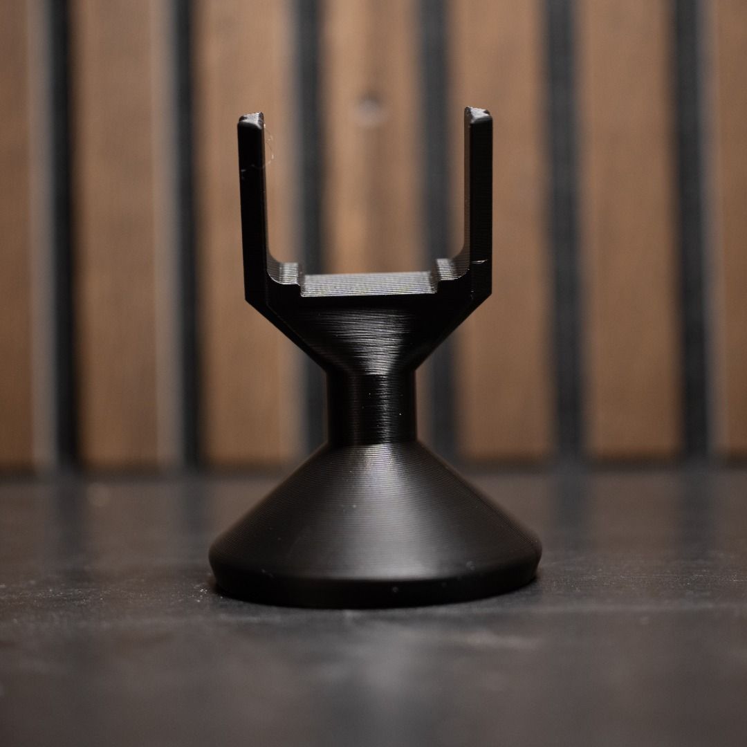 DJI Neo 2 Display Stand (Category: Drones) located in Mandaluyong City. Submitted by heyitslaaaance (Listing ID 1416887484, Image 2). Description: Selling a DJI Neo 2 Display Stand, purpose‑built to hold the drone securely while highlighting its compact size and front camera. The stand features a slim, desk‑friendly footprint with a stable weighted base, making it perfect for tabletops, shelves, studios, retail counters, or collector displays. It