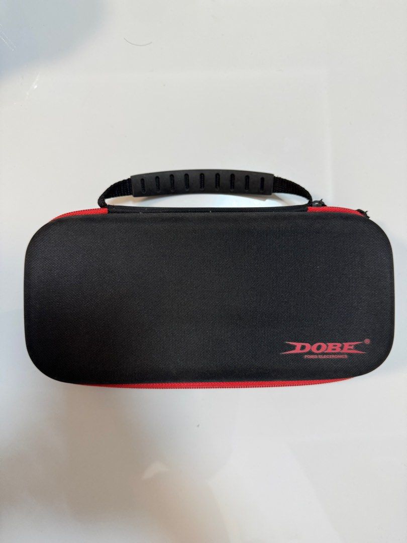 DOBE and Mumba Nintendo Switch Carrying Case (Category: Cases & Covers) located in Manila. Submitted by ernyrose (Listing ID 1416971634, Image 2). Description: 1) DOBE Nintendo Switch 1 travel carrying case (unused) + free Switch storage case - 600 php 2) MUMBA Nintendo Switch 1 travel carrying case slightly used, with light smudges that can be wiped off (see photo) - 700 php Take all for 1000 php RFS: Not using Switch anymore Payment thru BPI tr