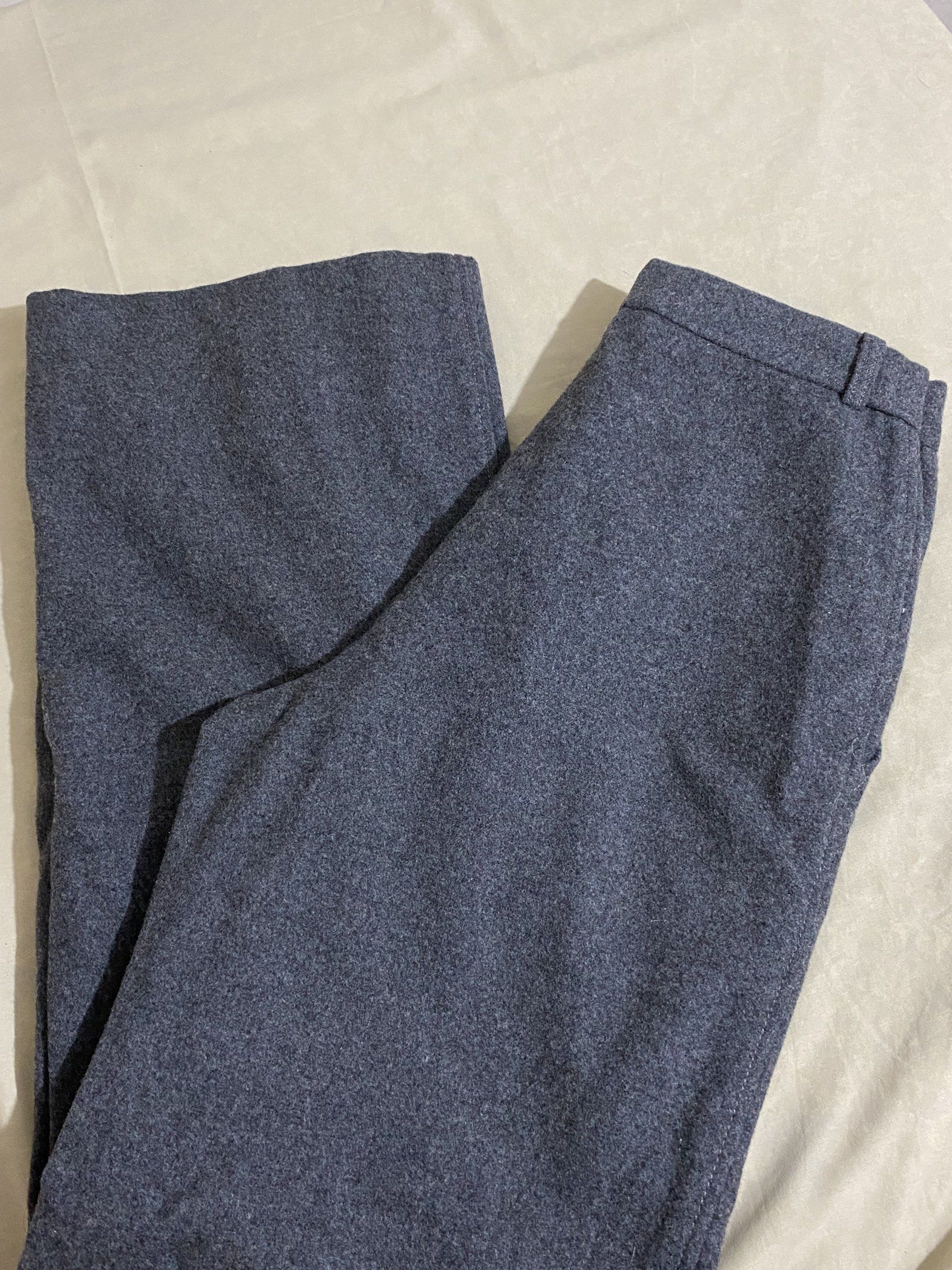 Gray Trouser (Category: Other Bottoms) located in Caloocan City. Submitted by kheiclutter (Listing ID 1416915093, Image 1). Description: - Gray wool pants - Classic design - Button closure - Tailored fit - Textured wool fabric - Straight leg cut - Suitable for casual and formal occasions.