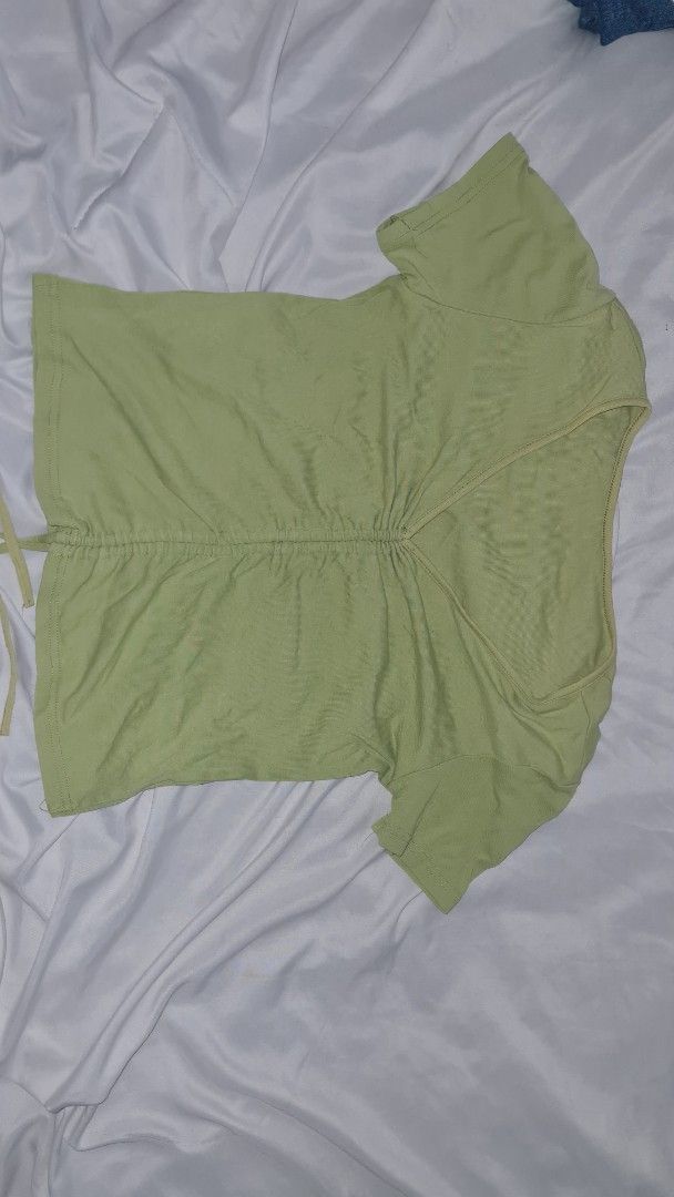 Green Ruched V-Neck Top Blouse (Category: Blouses) located in Quezon City. Submitted by bubugom (Listing ID 1416975642, Image 3). Description: - Green V-neck top - Ruched front design - Short sleeves - Adjustable ties at the bottom LOC: Brgy. Pasong Tamo, QC MOD: GRAB, Lalamove, JNT MOP: GCASH, BPI, GoTyme (NO COD & ABONO).