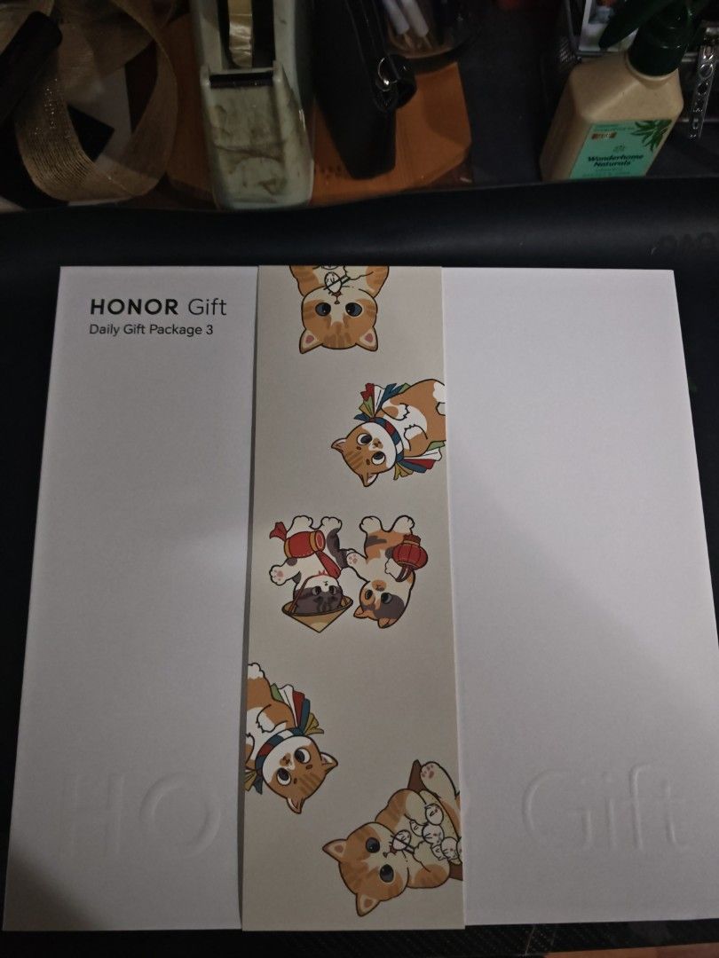 HONOR Gift Daily Gift Package 3 (Category: Makeup) located in Marikina City. Submitted by estore019 (Listing ID 1417024284, Image 1). Description: - Brand new, sealed HONOR Gift Daily Gift Package 3. - Features a white box with a decorative band of cartoon cats - Includes the HONOR Gift logo and "Daily Gift Package 3" with umbrella notebook and towel inside - Perfect as a gift!.
