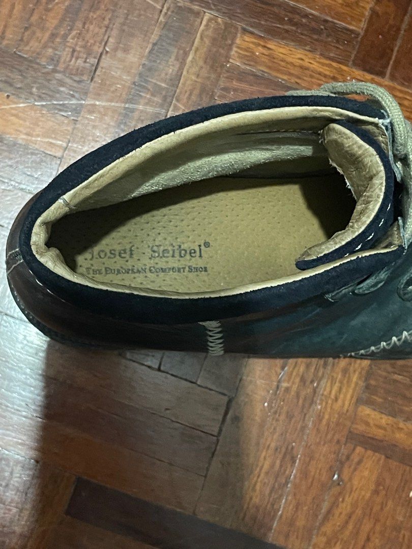 Josef Seibel Leather Ankle Boots (Category: Boots) located in Paranaque City. Submitted by spjuane (Listing ID 1416940093, Image 2). Description: Thrifted and used in Canada - Fits my size US8/8.5 (mens) - Extremely durable, needs wiping down/cleaning only - Josef Seibel ankle boots - Leather upper - Lace-up closure - Round toe - Low heel - Dark blue color - Softly lined interior.