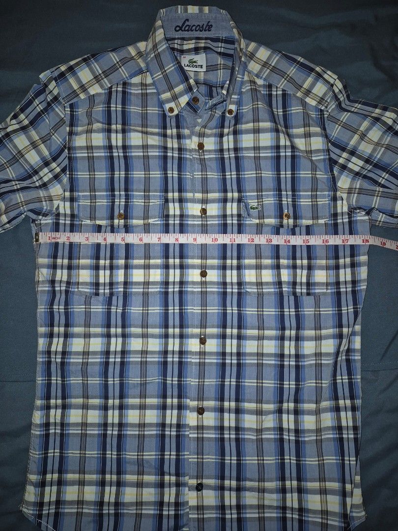 Lacoste Plaid Long Sleeve Shirt (Category: Tshirts & Polo Shirts ) located in Muntinlupa City. Submitted by matthewdavemanuel (Listing ID 1416946653, Image 2). Description: Authentic Lacoste long sleeve shirt Classic plaid pattern Button-down front Two chest pockets Embroidered Lacoste logo Color scheme: Blue, white, and navy Sizw 38 on Tag. Measurements are 18.5 inches width and 27.5 inches length.