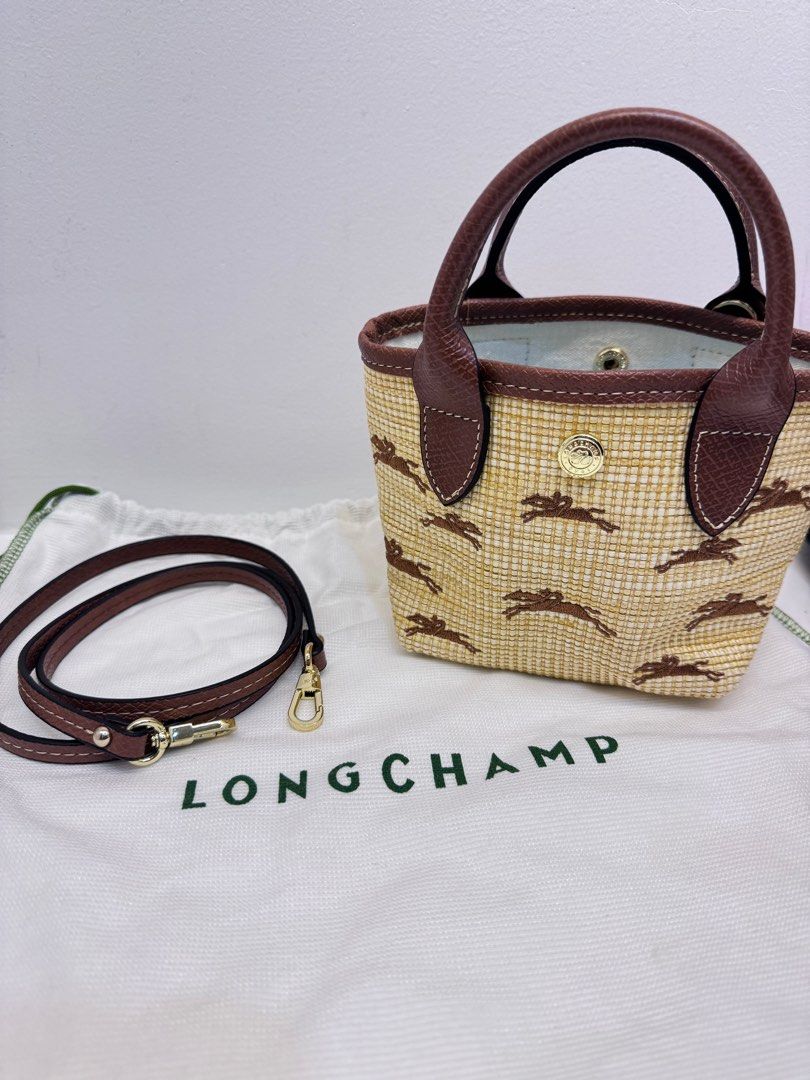 Longchamp Le Pliage Cuir Mini Tote Bag (Category: Luxury Bags & Wallets) located in Cabanatuan. Submitted by thearchivemuse (Listing ID 1416962117, Image 1). Description: - Longchamp Le Pliage Cuir Mini Tote Bag - Woven straw-like material with horse pattern - Brown leather handles and trim - Detachable shoulder strap - Includes Longchamp dust bag - Compact size, perfect for everyday use ORIG PRICE: ₱ 8,000.00.