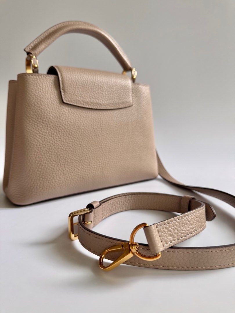 Louis Vuitton Capucines BB in Galet (Category: Luxury Bags & Wallets) located in Quezon City. Submitted by lian_closet (Listing ID 1416904600, Image 3). Description: Louis Vuitton Capucines BB in Galet Best Price: ₱150,000 Preloved Comes with Detachable Leather Strap, Dust Bags & Entrupy Certificate of Authenticity Preloved Rating: 9.5/10 Excellent Minimal hairline scratches on hardware Small crack on the piping No rubs on corners Interior is cle