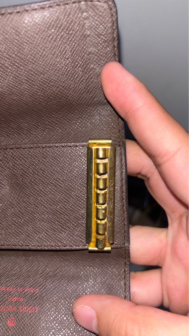 Louis Vuitton Key Holder Damier Ebene (Category: Luxury Bags & Wallets) located in Manila. Submitted by murangbagelya_ph (Listing ID 1416948049, Image 3). Description: - Authentic Louis Vuitton key holder - Damier Ebene pattern - Brown checkered exterior - Brown interior - Snap closure - Includes key hooks - Serial number: RG3210 - Made in Spain.