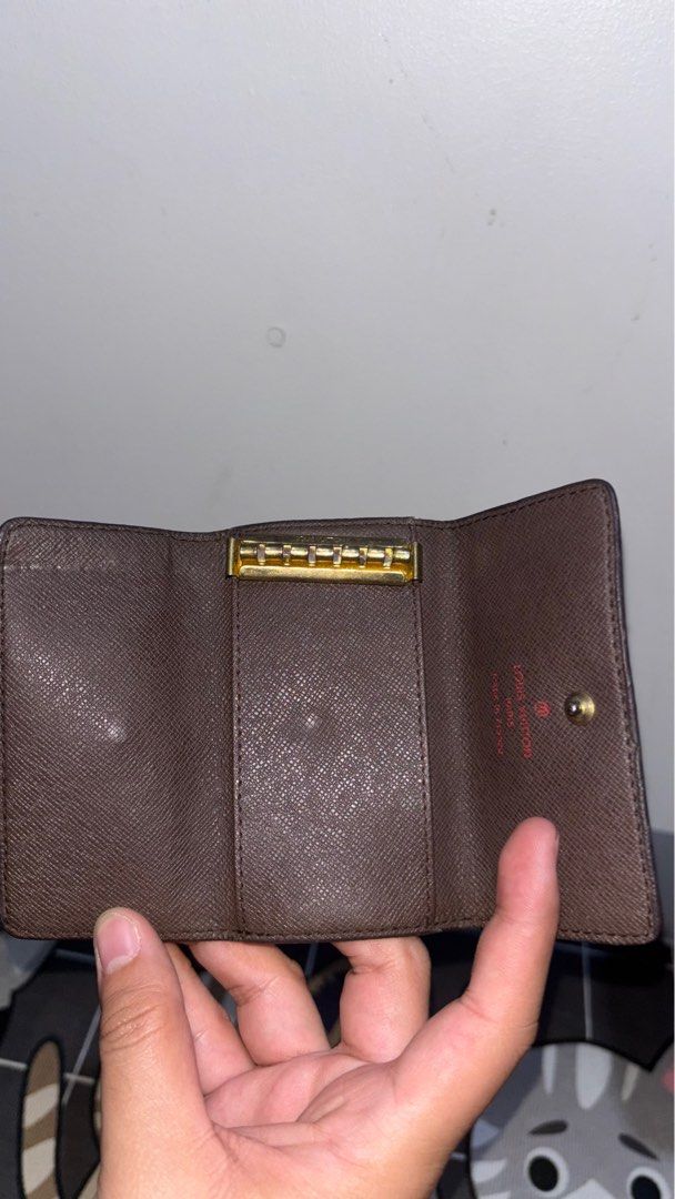 Louis Vuitton Key Holder Damier Ebene (Category: Luxury Bags & Wallets) located in Manila. Submitted by murangbagelya_ph (Listing ID 1416948049, Image 1). Description: - Authentic Louis Vuitton key holder - Damier Ebene pattern - Brown checkered exterior - Brown interior - Snap closure - Includes key hooks - Serial number: RG3210 - Made in Spain.