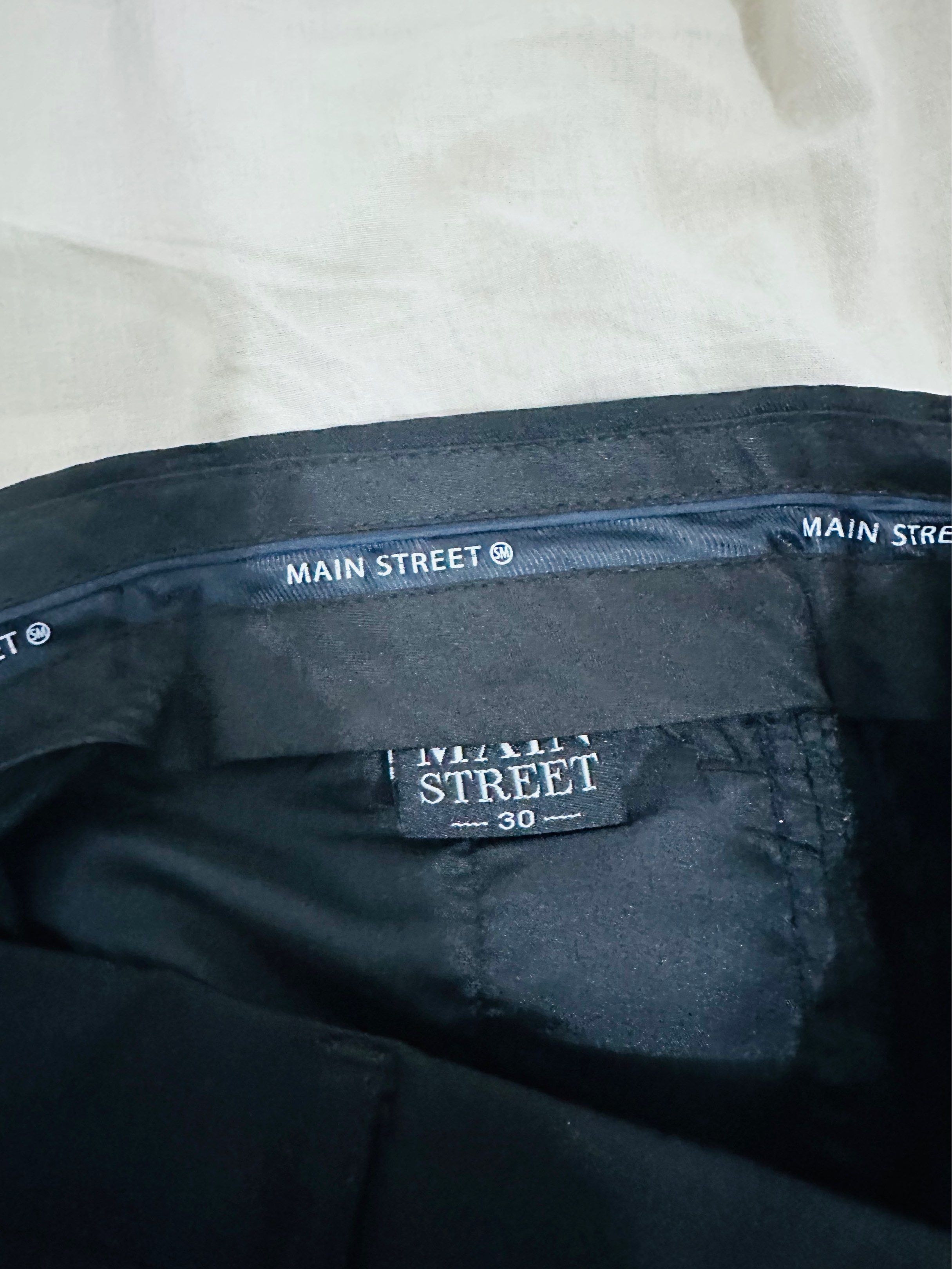 Main Street Black Pants Size 30 (Category: Jeans) located in Taguig. Submitted by ImpulzBuyer (Listing ID 1416964851, Image 1). Description: - Black Main Street pants - Size 30 waist - Classic straight-leg cut - Two back pockets with button closures - Made of smooth, solid fabric.
