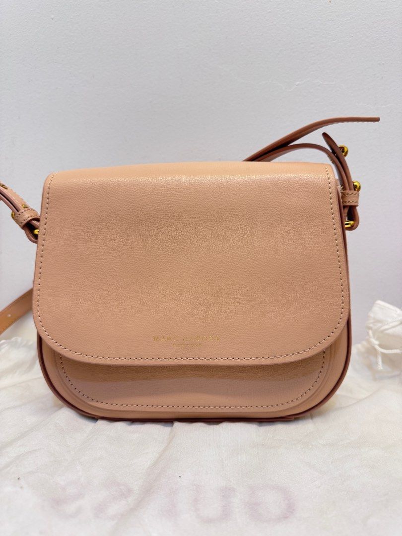 Marc Jacobs Saddle Bag (Category: Luxury Bags & Wallets) located in Cabanatuan. Submitted by thearchivemuse (Listing ID 1416963313, Image 1). Description: - Authentic Marc Jacobs Saddle Bag - Light Pink Color - Flap Closure - Adjustable Shoulder Strap - Gold-Tone Hardware & Tag - Main Compartment & Slip Pocket - Marc Jacobs Logo Detailing - Used it twice only ORIG PRICE: ₱ 12,000.