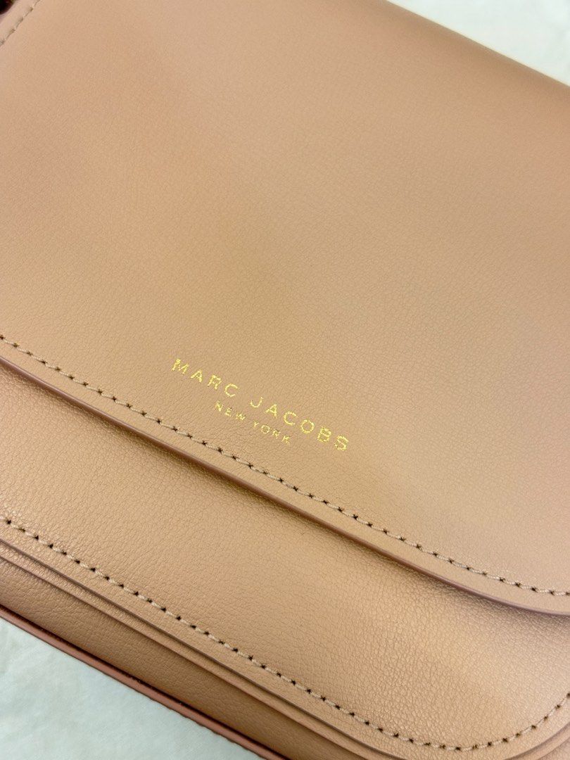 Marc Jacobs Saddle Bag (Category: Luxury Bags & Wallets) located in Cabanatuan. Submitted by thearchivemuse (Listing ID 1416963313, Image 3). Description: - Authentic Marc Jacobs Saddle Bag - Light Pink Color - Flap Closure - Adjustable Shoulder Strap - Gold-Tone Hardware & Tag - Main Compartment & Slip Pocket - Marc Jacobs Logo Detailing - Used it twice only ORIG PRICE: ₱ 12,000.