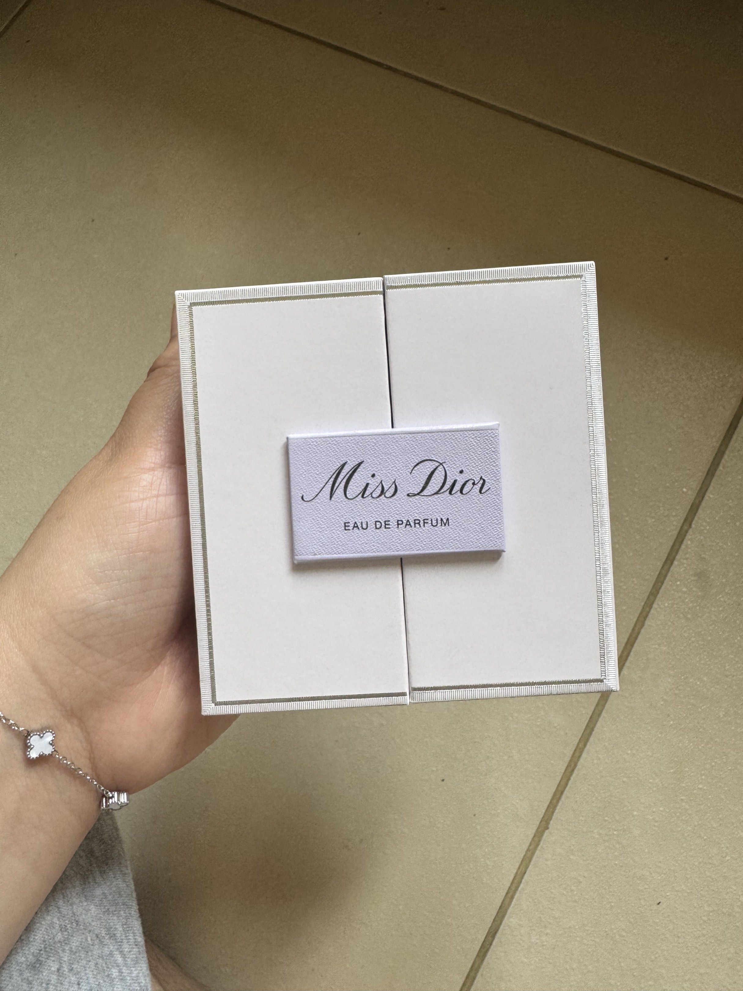 Miss Dior Eau de Parfum mini Set (Category: Fragrance & Deodorants) located in Pasay City. Submitted by sakusakusaku18 (Listing ID 1416847658, Image 1). Description: - Authentic Miss Dior set - Includes Eau de Parfum and body milk with rose wax - Comes in a white box - Features the Miss Dior logo - Perfume bottle adorned with a ribbon.