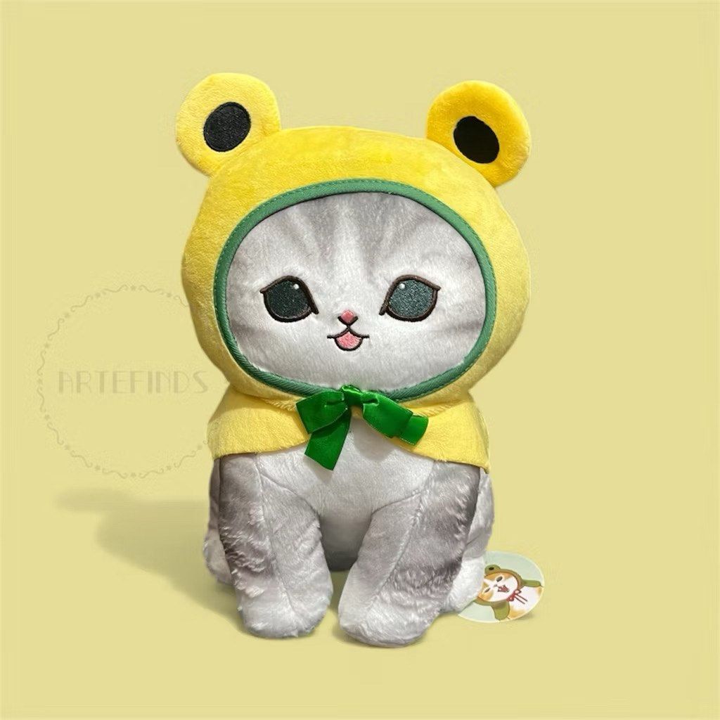 Mofusand Cat Plush - Frog Costume (Category: Plushies & Soft Toys) located in Pasig City. Submitted by pinkfluff17 (Listing ID 1417000109, Image 2). Description: Adorable Mofusand cat plushies in frog costumes! Available in two colors: orange tabby with a green frog hood and grey tabby with a yellow frog hood. Each plush features a cute cat face peeking out from the hood and a small bow. Perfect for cat lovers and collectors..