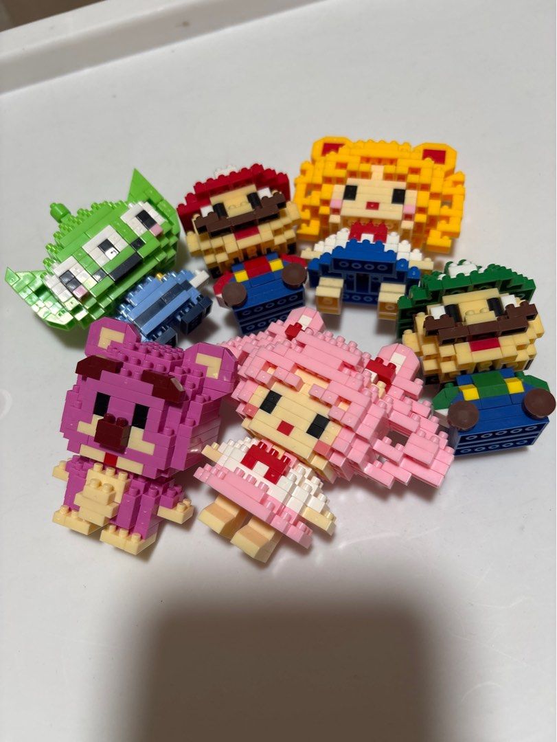MOVING OUT SALE: Mini Building Blocks Figures Set (Category: Lego & Building Sets) located in Manila. Submitted by matchagurl_ (Listing ID 1416996336, Image 1). Description: Take all bricks for 30 pesos Spare parts included RFS: Decluttering Tags: Sailor moon, sailor mini moon, mario & luigi, lotso, alien, toy story.