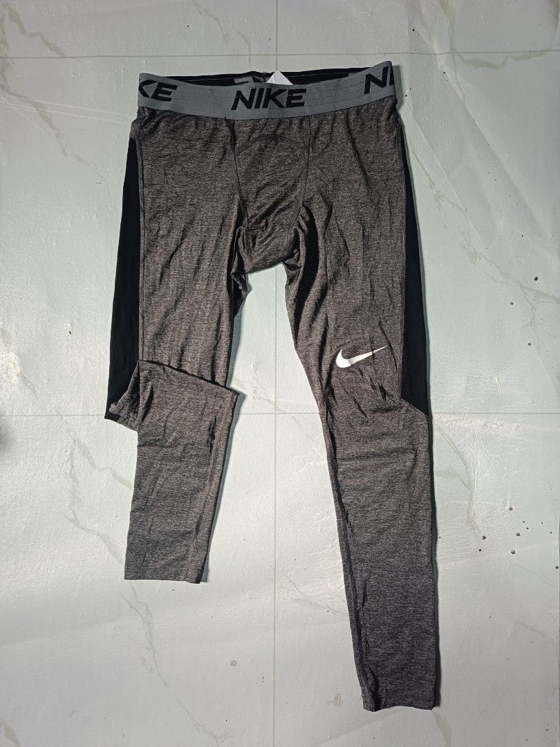 Nike Victory Dri-Fit Grey Black Compression Pants (Category: Activewear) located in Rosario. Submitted by livj. (Listing ID 1416901453, Image 1). Description: - Nike Pro Dri-FIT compression pants - Gray and black color scheme - Nike logo on leg and waistband - Size Medium tag is visible.