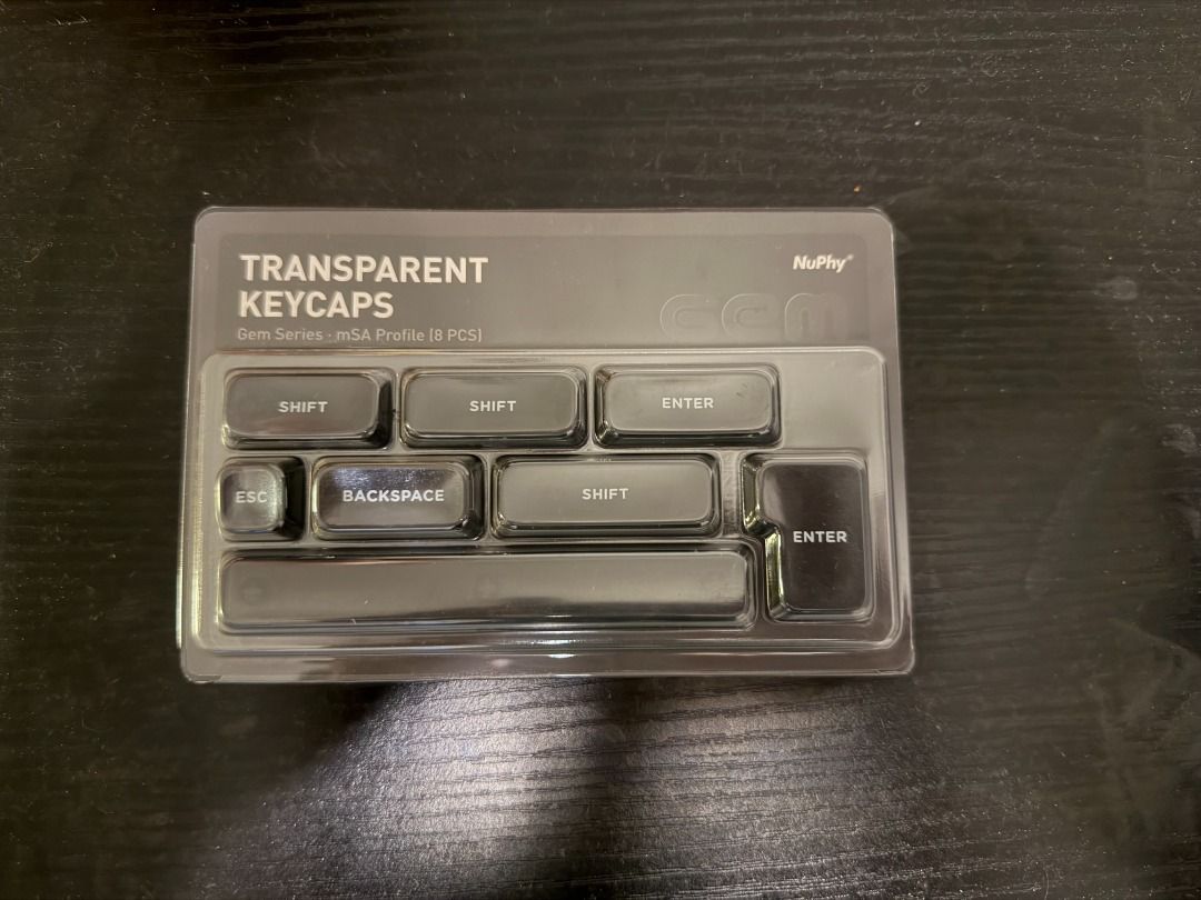 NuPhy Transparent Keycaps (Category: Computer Keyboard) located in Singapore. Submitted by blotgarage (Listing ID 1416899708, Image 1). Description: - Brand new NuPhy transparent keycaps - Includes keycaps for Enter, Shift, Backspace, Esc, and spacebar - Made of PC material - Perfect for keyboard customization.