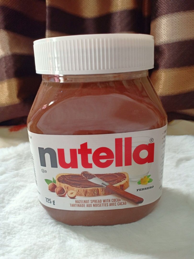 Nutella Hazelnut Spread 725g (Category: Other Food & Drinks) located in Muntinlupa City. Submitted by fabulous05 (Listing ID 1416988125, Image 1). Description: Sealed jar of Nutella hazelnut spread with cocoa. The jar contains 725g. Expiry date is March 11, 2026. Perfect for spreading on bread, pancakes, or enjoying straight from the jar. A delicious treat for breakfast or snack time..
