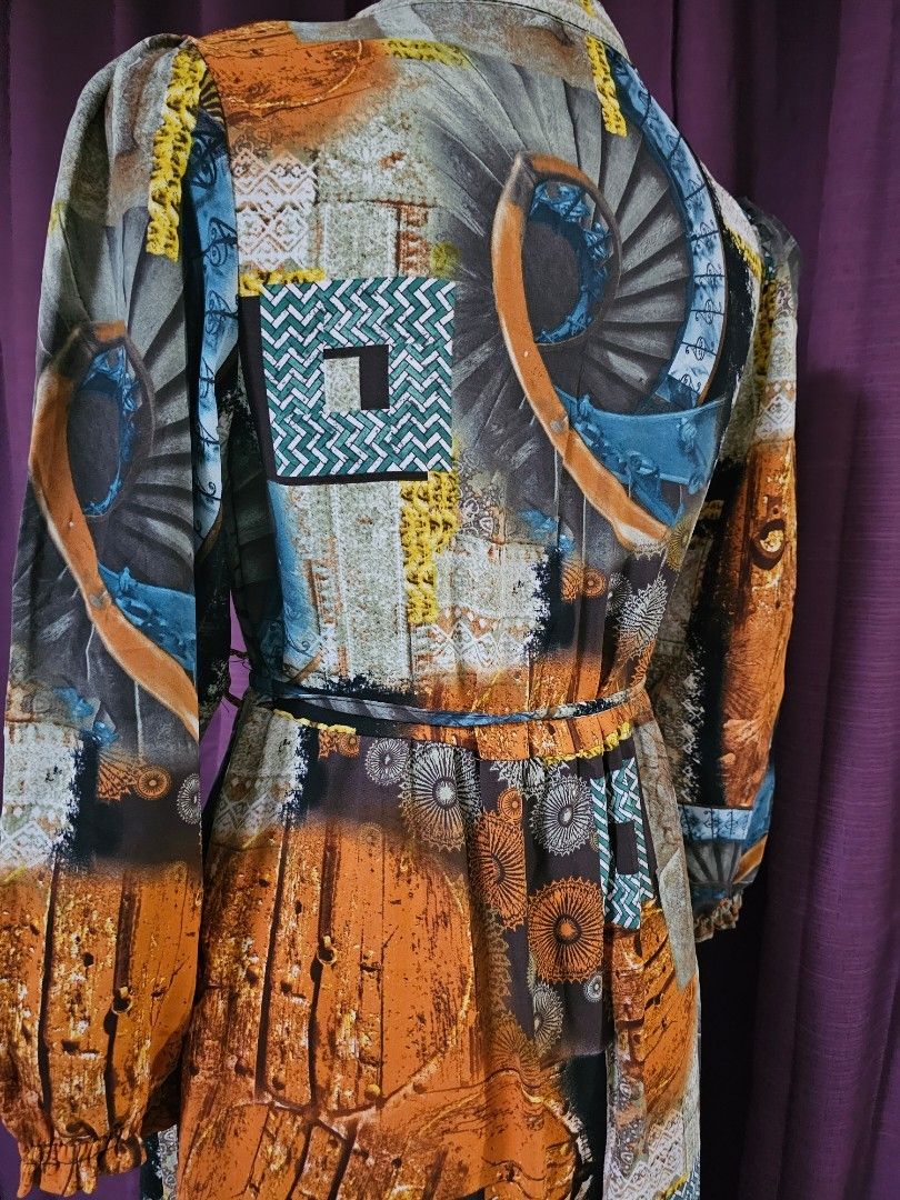 Printed Dress (Category: Dresses) located in Silang. Submitted by a.r.a_15 (Listing ID 1415095208, Image 3). Description: - Unique print in orange, blue, and white - Collared neckline - Fitted silhouette - Lightweight fabric - Short sleeves - Knee-length hemline - Cinched waist.